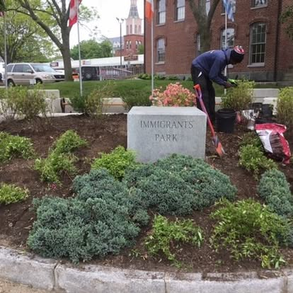 Landscaper tending the garden at Immigrants Park